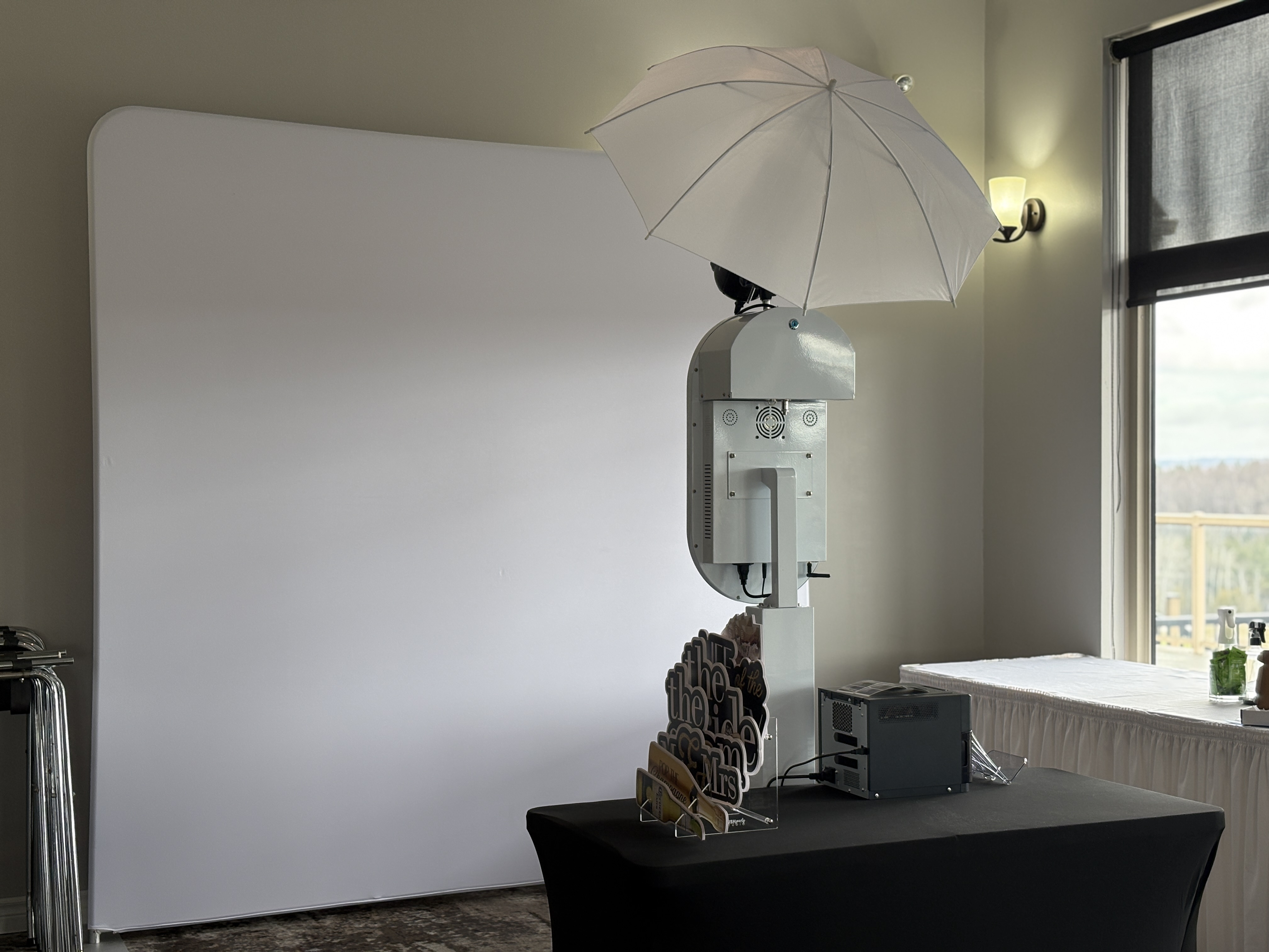 Open-air photobooth backdrop and lighting setup at Tangle Creek Golf Course